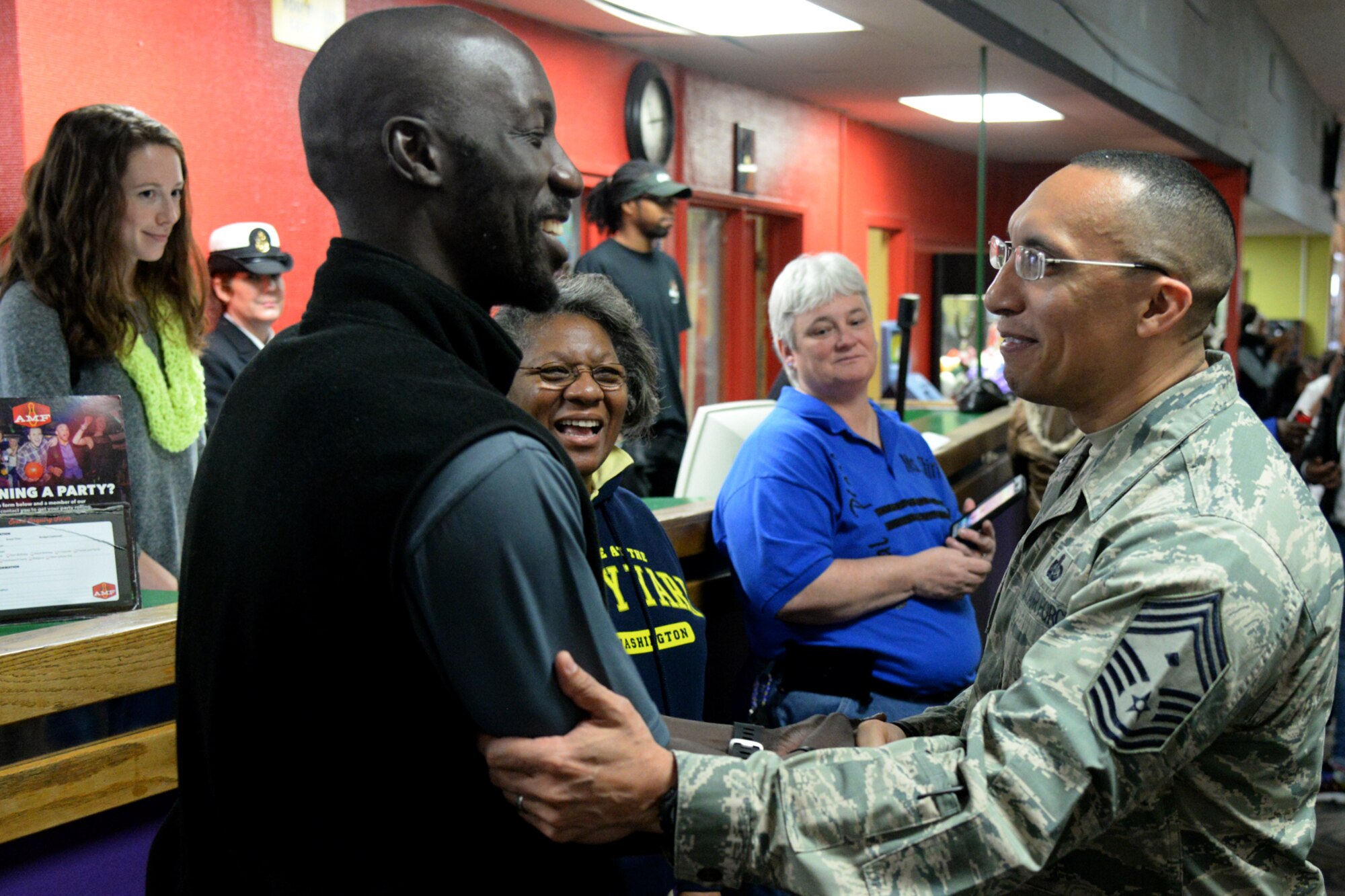 Air Force District of Washington First Sergeant Chief Master Sgt. Manny Pineiro thanks Special Olympics D.C. staff for their work during the D.C. Special Olympics Bowling Championship in Hyattsville, Md., Feb. 25, 2016. More than 70 Airmen from across the National Capital Region volunteered to support athletes competing in the event. (U.S. Air Force photo/Tech. Sgt. Matt Davis)