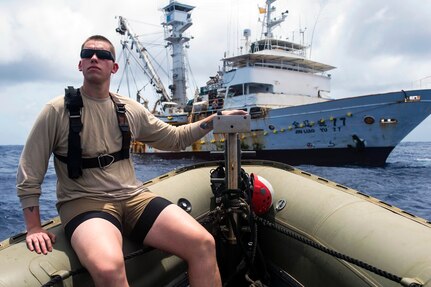 Navy Petty Officer 2nd Class Cosmo Arnold embarks on a rigid-hull inflatable boat dispatched from the guided-missile destroyer USS William P. Lawrence in the Pacific Ocean, Feb. 22, 2016. Providing a ready force supporting security and stability in the Indo-Asia Pacific, William P. Lawrence, commanded by Cmdr. Walter C. Mainor, is operating as part of the John C. Stennis Strike Group and Great Green Fleet on a regularly scheduled 7th Fleet deployment. U.S. Navy photo by Petty Officer 3rd Class Emiline L. M. Senn
