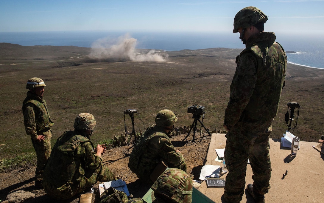 Soldiers with Western Army Infantry Regiment, Japan Ground Self-Defense Force, observe naval gunfire from the USS Spruance (DDG-111) during a supporting arms coordination center exercise (SACCEX) at San Clemente Island, Feb. 22, 2016, as part of Exercise Iron Fist 2016. SACCEX  serves as a cooperative learning tool for the US-Japan partnership through the operation of supporting arms coordination center, which has developed the USMC and JGSDF’s ability to intergrate naval gunfire, mortars and close-air support  as a combined force.