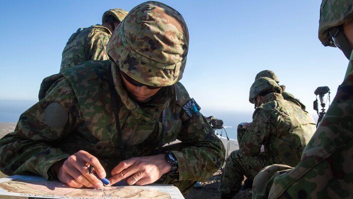 A soldier with Western Army Infantry Regiment, Japan Ground Self-Defense Force, plots map points for impending naval gunfire during a supporting arms coordination center exercise(SACCEX) at San Clemente Island, Feb. 21, 2016, during Exercise Iron Fist 2016. The SACCEX serves as a cooperative learning tool for the US-Japan partnership through the operation of a supporting arms coordination center, which has developed the USMC and JGSDF’s ability to integrate naval gunfire, mortars and close-air support  as a combined force. 