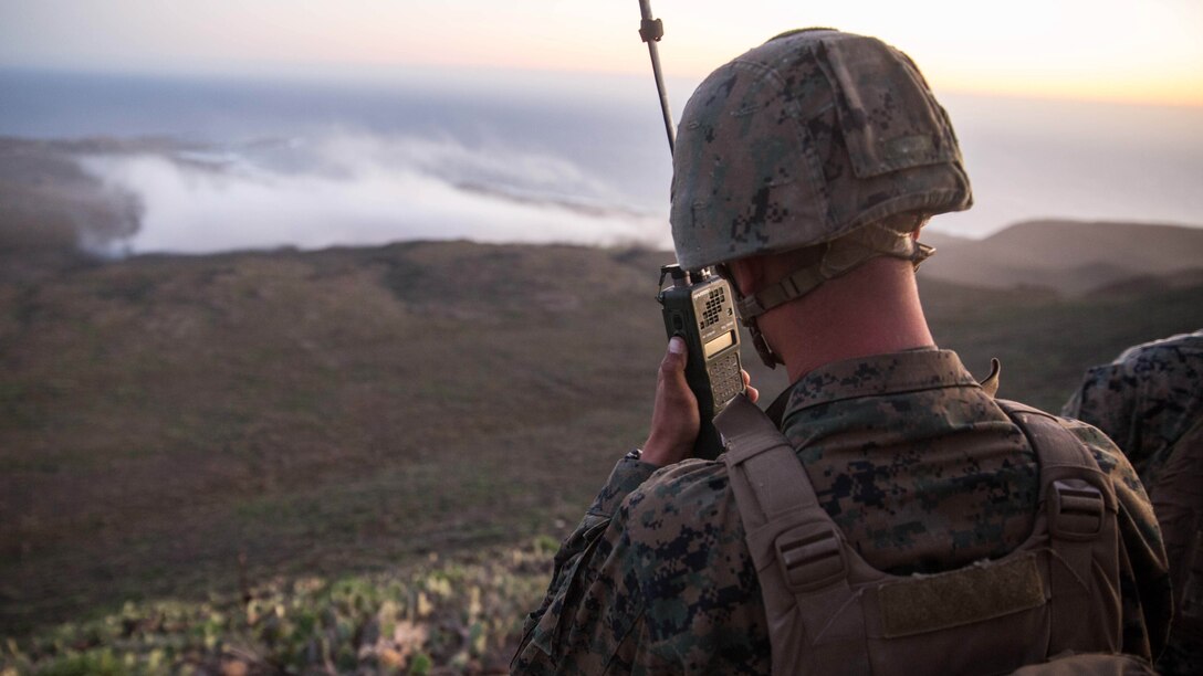 Lance Cpl. Christian Frohlich, a radio operator with 1st Air Naval Gunfire Liasion Company, relays fire missions to the objective area of a naval gunfire bombing range during the supporting arms coordination center exercise (SACCEX) portion of Exercise Iron Fist 2016, on San Clemente, Feb. 21, 2016. The SACCEX provides U.S. and Japanese forces with hands-on experience in tactics proven to be effective in securing enemy-occupied shorelines during large-scale amphibious assaults. 