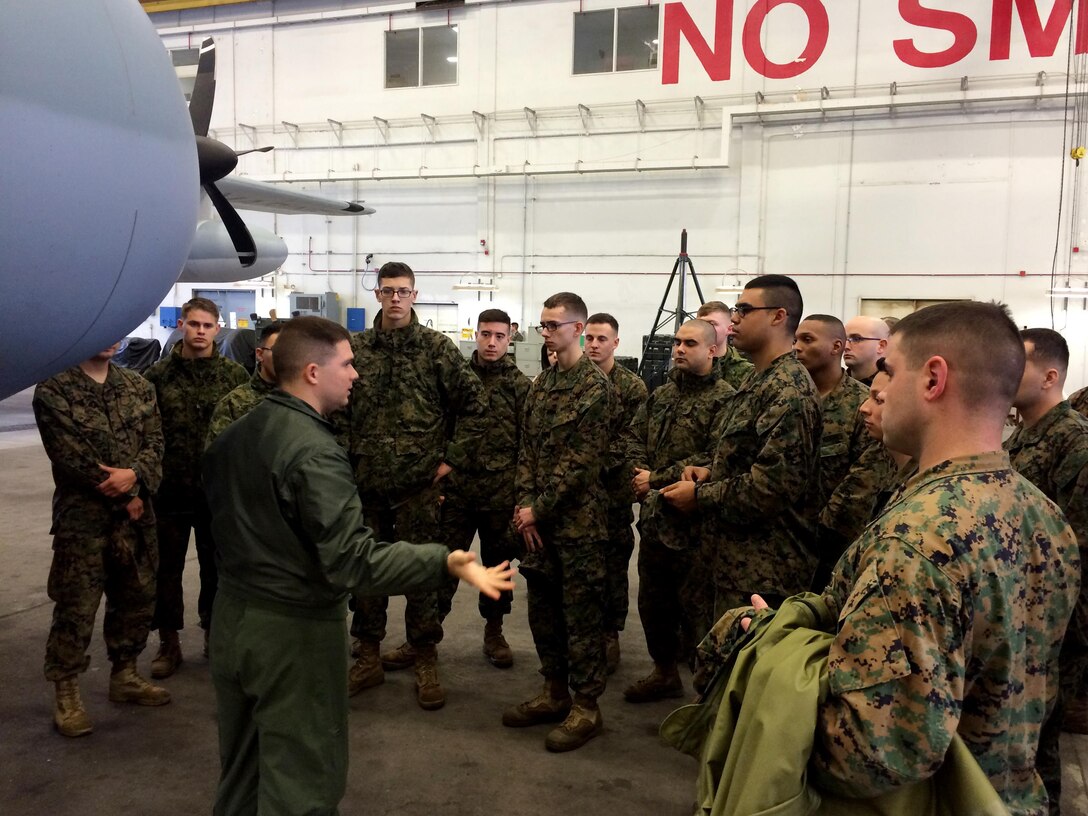 Staff Sgt. Daniel C. Pye explains the capabilities of a KC-130J Super Hercules to students during a Squadron Intelligence Training and Certification Course at Marine Corps Air Station Cherry Point, N.C., Feb. 12, 2016. The course combines classroom instruction as well as intense student intelligence evaluation and briefing requirements followed by practical application events in direct support of live aviation requirements. Pye is a flight leadership standardization evaluator for the Marine Aviation Training Standardization Squadron. (Photo by Timothy D. Andres/Released)