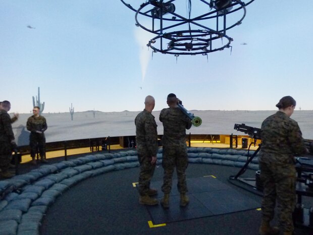 An instructor directs Pfc. Anthony Kinney on how to properly use a replica of an FM-92 Stinger Missile with simulation capabilities during a Squadron Intelligence Training and Certification Course at Marine Corps Air Station Cherry Point, N.C., Feb. 10, 2016. The course combines classroom instruction as well as intense student intelligence evaluation and briefing requirements followed by practical application events in direct support of live aviation requirements. (Courtesy photo by Timothy D. Andres Released)