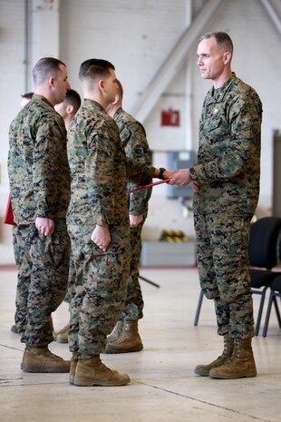 Maj. Gen. Gary L. Thomas congratulates and hands a certificate of course completion to Sgt. Alexander Rankin at the conclusion of a Squadron Intelligence Training and Certification Course at Mid Atlantic Electronic Warfare Range, N.C., Feb. 12, 2016. To date, the course has certified more than 300 Marines enabling them to better integrate into the Marine Air-Ground Task Force.  Thomas is the commanding general of 2nd MAW and Rankin is an intelligence specialist with Marine Aircraft Group 14.  (U.S. Marine Corps photo by Cpl. Jason Jimenez/Released)