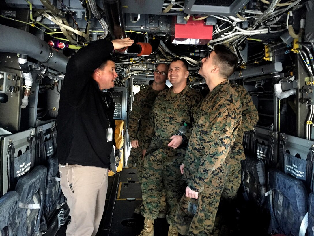 Students familiarize themselves on the parts of an MV-22 Osprey during a Squadron Intelligence Training and Certification Course at Marine Corps Air Station New River, N.C., Feb. 12, 2016. The course combines classroom instruction as well as intense student intelligence evaluation and briefing requirements followed by practical application events in direct support of live aviation requirements. Cabingas is an intelligence coordinator for the Intelligence Training Enhancement Program. (Photo by Timothy D. Andres/Released)