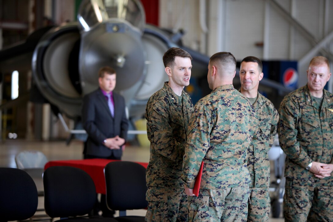 1st Lt. David Cox congratulates a graduate at the conclusion of Squadron Intelligence Training and Certification Course at Mid Atlantic Electronic Warfare Range, N.C., Feb. 12, 2016. To date, the course has certified more than 300 Marines enabling them to better integrate into the Marine Air-Ground Task Force. Cox is the officer in charge of the SITCC. (U.S. Marine Corps photo by Cpl. Jason Jimenez/Released)