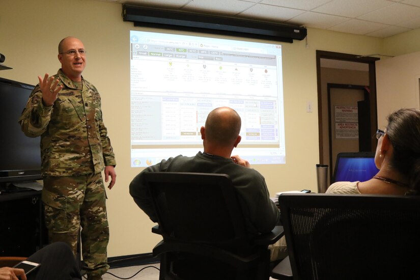 Lt. Col. Bentio demonstrates the Mission Analysis, Readiness & Resource Synchronization (MARRS) system during a brief to various Army Reserve Soldiers in leadership roles. The MARRS system provides information and has the capacity to leverage Reserve Component Manpower System and other Reserve Component unique data to better facilitate the capabilities of the Army Reserve. (U.S. Army Reserve photo by Sgt. Bethany L. Huff)