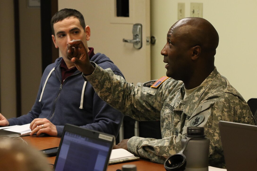 Capt. Brian Jackson, an Army Reserve Engagement Cell Planner for Army South, asks for more information about the Mission Analysis, Readiness & Resource Synchronization (MARRS) during an informational brief with various Army Reserve Soldiers in leadership roles. The Army Reserve currently has the capability to perform a full range of operations, which include disaster response with facilities located in 1,200 communities across the nation. (U.S. Army Reserve photo by Sgt. Bethany L. Huff)