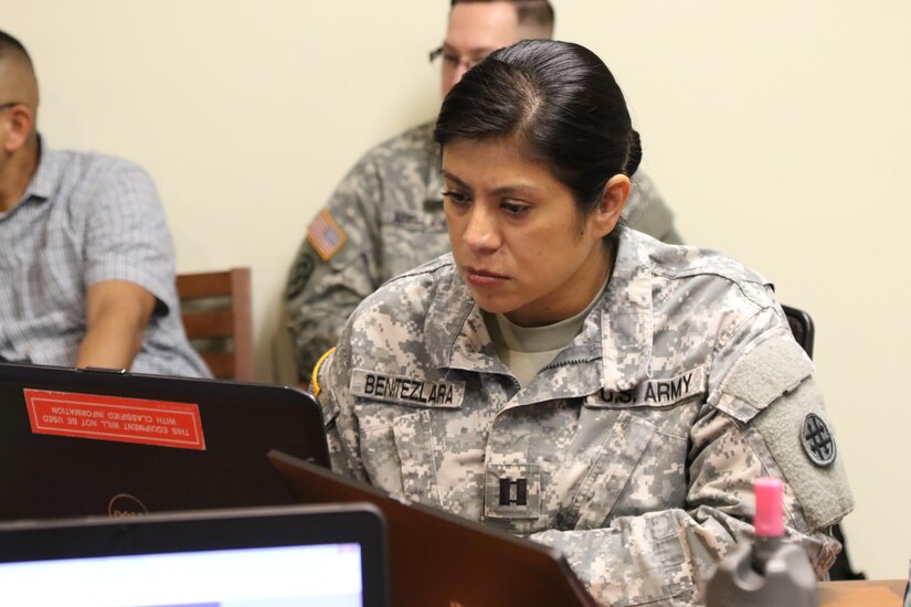 Capt. Gabrila Benitezlara, the Collective Training Officer in Charge for the 4th Expeditionary Sustainment Command, tests out the new Mission Analysis, Readiness & Resource Synchronization (MARRS) system during an information brief for Army Reserve Soldiers in leadership roles. The MARRS system will help to de-conflict scheduling of units as well as leveraging the remainder of Soldiers within those Reserve units. (U.S. Army Reserve photo by Sgt. Bethany L. Huff)