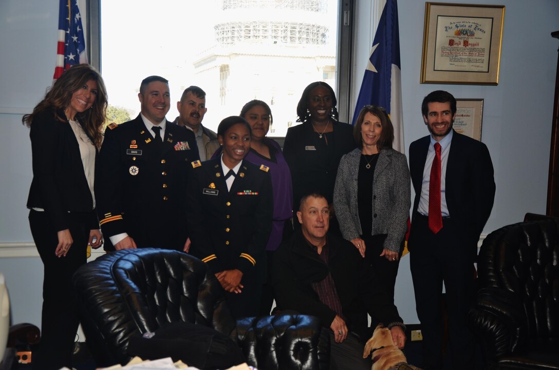 Members of Forward Support Company’s Family Readiness Group pose for a photo with Doug Molof, senior legislative assistant to Congressman Lloyd Doggett (D-TX-35). The FRG toured several locations in Washington after receiving 2015 Department of Defense Reserve Family Readiness Award, Feb. 26, as the best FRG in the Army Reserve.