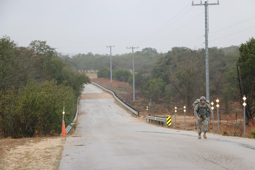 U.S. Army Spc. Matthew Nunez, Soldier with the 851st Transportation Company, 319th Combat Sustainment Support Battalion, 211th Regional Support Group, 4th Sustainment Command (Expeditionary) completes a ruck march during the 2016 4th ESC Best Warrior Competition at Joint Base San Antonio, Feb. 20, 2016. (U.S. Army Photo by Capt. Jose L. Caballero Jr./Released)