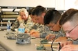 Soldiers with the 4th Sustainment Command (Expeditionary) receive refresher map reading training to prepare for the land navigation course during the 2016 4th ESC Best Warrior Competition at Joint Base San Antonio, Feb. 19, 2016. (U.S. Army Photo by Capt. Jose L. Caballero Jr./Released)