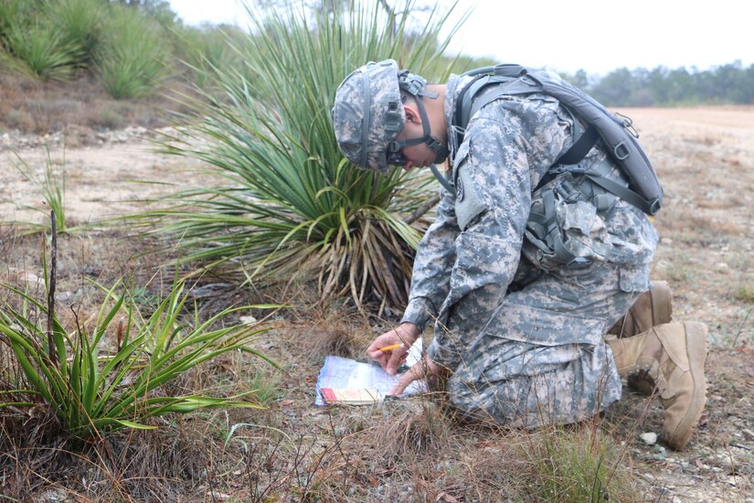 U.S. Army Spc. Bryan Hernandez, Soldier with the 79th Quartermaster Company, 373rd Combat Sustainment Support Brigade, 4th Sustainment Command (Expeditionary), checks his map on the land navigation course during the 2016 4th ESC Best Warrior Competition at Joint Base San Antonio, Feb. 20, 2016. (U.S. Army Photo by Capt. Jose L. Caballero Jr./Released)