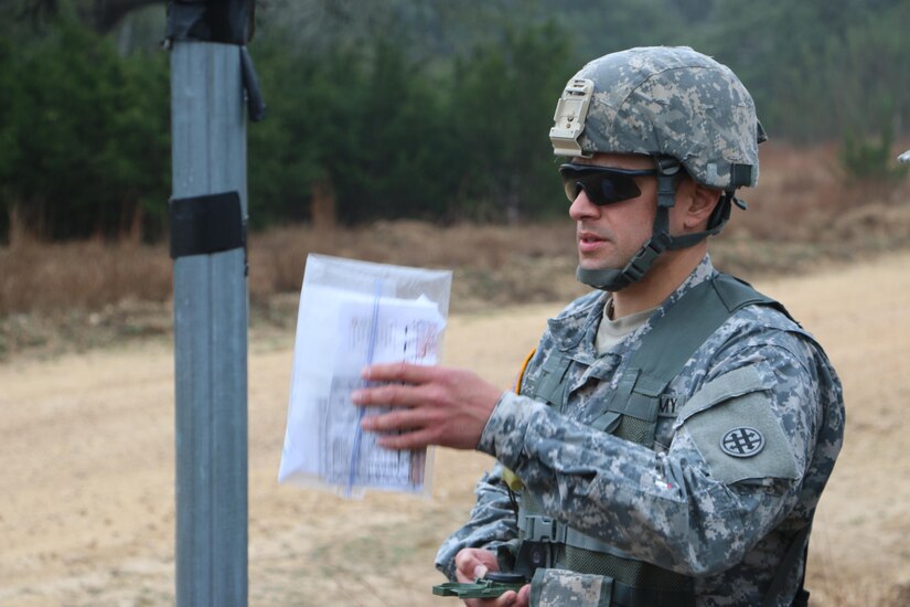 U.S. Army Staff Sgt. Hector Suarez, noncommissioned officer with the 851st Transportation Company, 319th Combat Sustainment Support Battalion, 211th Regional Support Group, 4th Sustainment Command (Expeditionary) prepares to step off to his check point on the land navigation course during the 4th ESC Best Warrior Competition at Joint Base San Antonio, Feb. 20, 2016. (U.S. Army Photo by Capt. Jose L. Caballero Jr./Released)