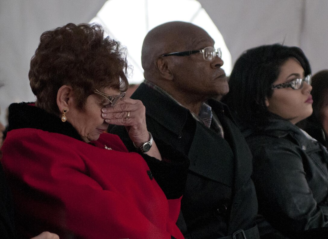 A mother of a Soldier from the 14th Quartermaster Detachment, who died during a scud missile attack in Operation Desert Storm, cries while hearing the names of the fallen Soldiers of the 14th Quartermaster Detachment during a memorial service in Greensburg, Pa., Feb. 25, 2016. (U.S. Army photo by Staff Sgt. Dalton Smith/Released)