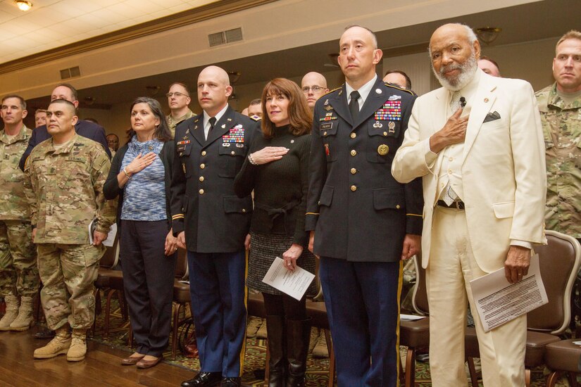 James H. Meredith (right), a prominent civil rights activist, stands with members of the Fort Hood, Texas, military community during the national anthem at an African-American/Black History Month Observance event Feb. 25, 2016, at Fort Hood. (U.S. Army photo by Sgt. Alexander Skripnichuk, 13th Public Affairs Detachment)