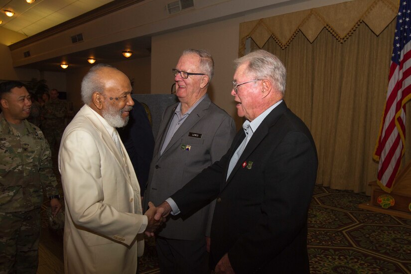 James H. Meredith (left), a prominent civil rights activist, shakes hands with Gary L. Hacbarth, a veteran from 720th Military Police Battalion, 89th MP Brigade, Fort Hood, Texas, during an African-American/Black History Month Observance event Feb. 25, 2016, at Fort Hood. Hacbrath was assigned to guard Meredith during his historic attendance at the University of Mississippi in 1962. (U.S. Army photo by Sgt. Alexander Skripnichuk, 13th Public Affairs Detachment)