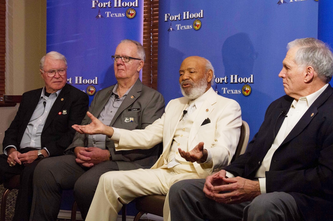 James H. Meredith (second from right), a prominent civil rights activist, and Gary L. Hackbarth (left), George Lewis (second from left) and Robert Taylor (right), veterans from 720th Military Police Battalion, 89th MP Brigade, Fort Hood, Texas, respond to questions from the local and national media during a African-American/Black History Month Observance event Feb. 25, 2016, at Fort Hood. (U.S. Army photo by Sgt. Alexander Skripnichuk, 13th Public Affairs Detachment)