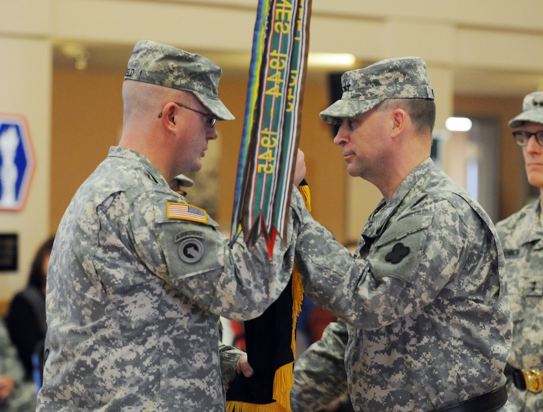 Maj. Gen. Patrick J. Reinert, the new commanding general of the 88th Regional Support Command, passes the 88th RSC colors to Command Sgt. Maj. David Unseld during a change of command ceremony on Fort McCoy, Wis., Dec. 4. As part of military tradition, this act symbolizes the commander’s confidence in the noncommissioned officer corps and is the command sergeant major’s first act of allegiance to the new commander. “Together we can ensure our supported units are ready, accessible and available for any contingency anywhere to complement the active Army and joint force,” said Reinert. "I look forward to meeting this challenge with all of you. All standing orders remain in effect.”