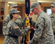 Maj. Gen. Karen Ledoux receives the 88th Regional Command colors from Command Sgt. Maj. David Unseld for the last time during a change of command ceremony on Fort McCoy, Wis., Dec. 4. “During my tenure as the 88th RSC commander, I have truly been blessed to be surrounded by such energetic, focused and proficient leaders, civilians and Soldiers,” said Ledoux. “Any achievement that I have had is due to your hard work and efforts – and it has truly been my pleasure to serve together and enable readiness for our Army Reserve units.”