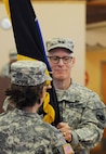 Maj. Gen. Karen Ledoux passes the 88th Regional Command colors to Maj. Gen. Peter Lennon, U.S. Army Reserve commanding general for support, during a change of command ceremony on Fort McCoy, Wis., Dec. 4. As part of military tradition, this act symbolizes the end of her command - the relinquishment of her command authority. “Command is always a privilege and commanding the 88th RSC has been my honor,” said Ledoux.