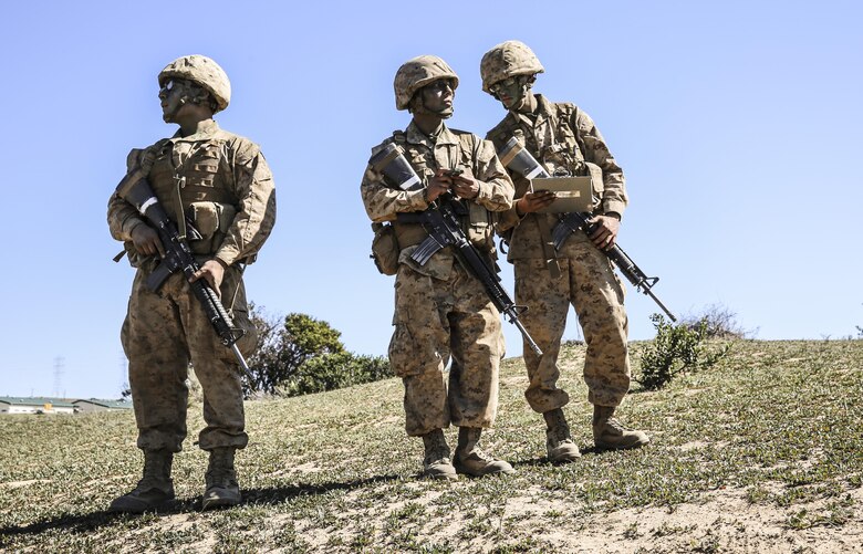 Recruits of Echo Company, 2nd Recruit Training Battalion, work together to find a way to the next point during the Land Navigation Course at Edson Range, Marine Corps Base Camp Pendleton, Feb. 24. During Field Week of recruit training, throughout the hilly terrain of Camp Pendleton recruits learned the basic fundamentals of combat, everything from combat formations to land navigation. The course is buried deep in the mountainous terrain of Camp Pendleton, covered with cacti, bushes, and wildlife. Annually, more than 17,000 males recruited from the Western Recruiting Region are trained at MCRD San Diego. Echo Company is scheduled to graduate March 4.