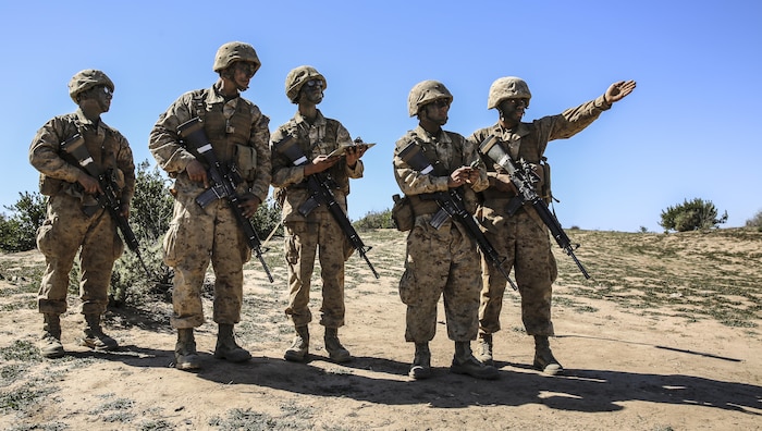 Recruits of Echo Company, 2nd Recruit Training Battalion, determine the direction to their mark during the Land Navigation Course at Edson Range, Marine Corps Base Camp Pendleton, Calif., Feb. 24. Going through the course with minimal, or at times no supervision, recruits had a chance to get a sense of the critical factor of learning and properly executing the techniques they were taught. Annually, more than 17,000 males recruited from the Western Recruiting Region are trained at MCRD San Diego. Echo Company is scheduled to graduate March 4.
