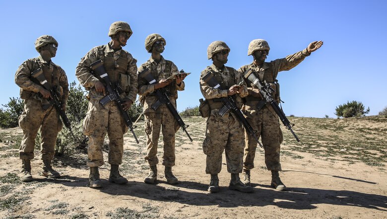 Recruits of Echo Company, 2nd Recruit Training Battalion, determine the direction to their mark during the Land Navigation Course at Edson Range, Marine Corps Base Camp Pendleton, Calif., Feb. 24. Going through the course with minimal, or at times no supervision, recruits had a chance to get a sense of the critical factor of learning and properly executing the techniques they were taught. Annually, more than 17,000 males recruited from the Western Recruiting Region are trained at MCRD San Diego. Echo Company is scheduled to graduate March 4.