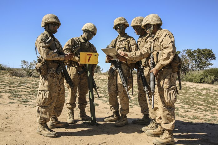 Recruits of Echo Company, 2nd Recruit Training Battalion, find one of their points during the Land Navigation Course at Edson Range, Marine Corps Base Camp Pendleton, Feb. 24. During Field Week of recruit training, throughout the hilly terrain of Camp Pendleton recruits learned everything from combat formations to land navigation. The course is buried deep in the mountainous terrain of Camp Pendleton, covered with cacti, bushes, and wildlife. Annually, more than 17,000 males recruited from the Western Recruiting Region are trained at MCRD San Diego. Echo Company is scheduled to graduate March 4.