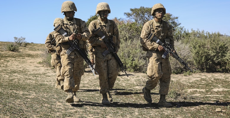 Recruits of Echo Company, 2nd Recruit Training Battalion, trek toward their mark during the Land Navigation Course at Edson Range, Marine Corps Base Camp Pendleton, Calif., Feb. 24. Prior to starting the event, recruits received classes on land navigation techniques and how to properly use a map and compass while out in the field. Annually, more than 17,000 males recruited from the Western Recruiting Region are trained at MCRD San Diego. Echo Company is scheduled to graduate March 4.