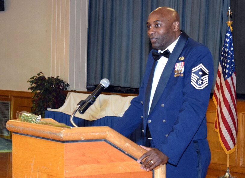 Senior Master Sgt. (Dr.) Eric J. Smith, 340th Flying Training Group, addresses the crowd during the 433rd Annual Awards Banquet Feb. 27, 2015 at Mitchell Hall, Joint Base San Antonio-Lackland, Texas. Smith, a former Alamo Wing member, was the keynote speaker for the event. (U.S. Air Force photo by Tech. Sgt. Lindsey Maurice)  