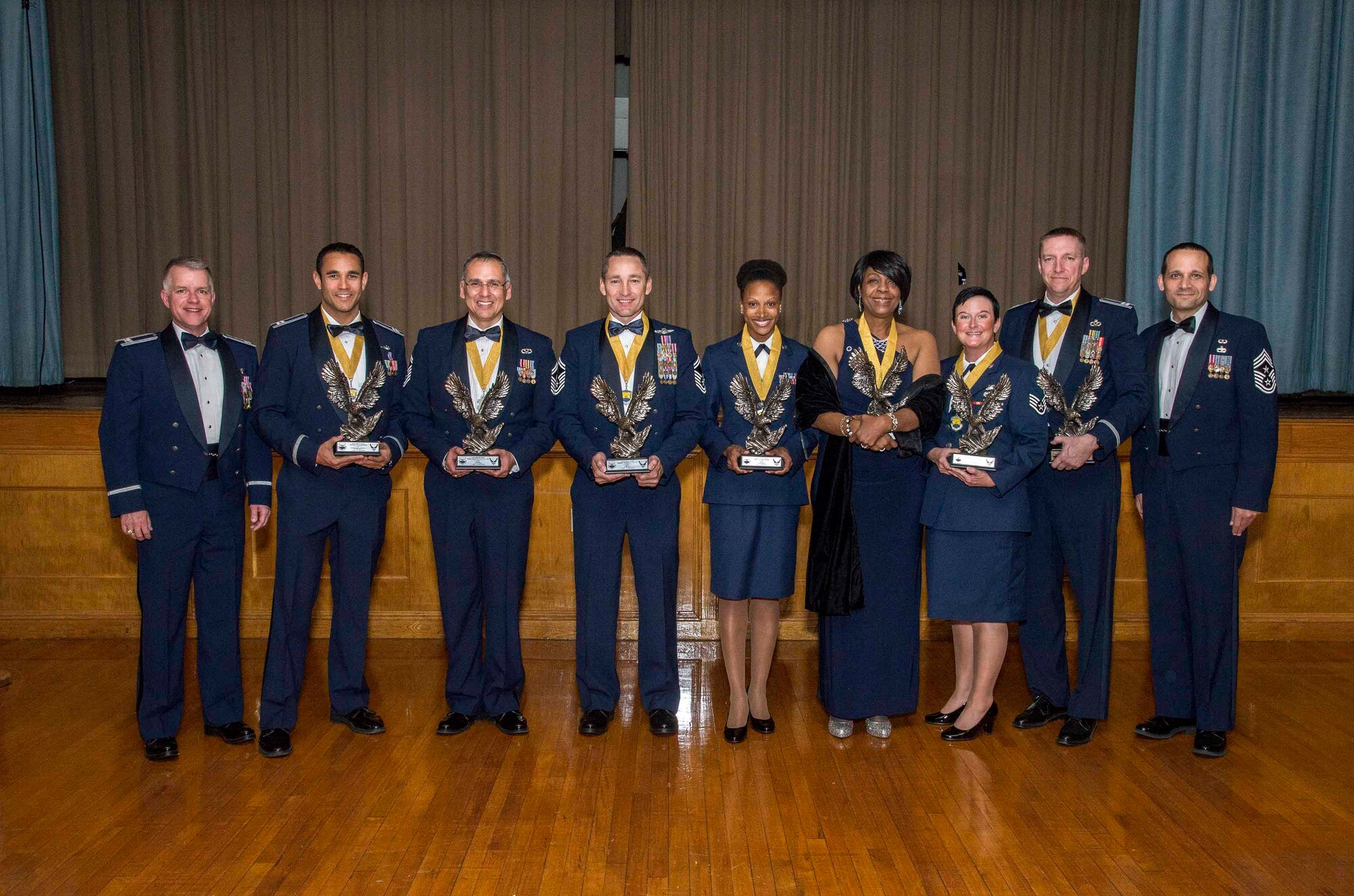 Col. David Scott (left), 433rd Airlift Wing vice commander, and Chief Master Sgt. Brian Pinsky (right), 433rd AW command chief, pose with the 2015 433rd AW Annual Award Winners at the end of the banquet Feb. 27, 2015 at Mitchell Hall, Joint Base San Antonio-Lackland, Texas. The finalists are (from left to right): Civilian Category III, Nathan Strohschein, 356th Airlift Squadron; First Sergeant of the Year, Senior Master Sgt. Samuel Caballero Jr., 74th Aerial Port Squadron; Company Grade Officer of the Year, Capt. David Shaw, 433rd Civil Engineer Squadron; Noncommissioned Officer of the Year, Staff Sgt. Lin Adams, 433rd Aerospace Medicine Squadron; Civilian Category II, Minnie Jones, 433rd AW; Staff Sgt. Roberta Kidder, 733rd Training Squadron; and Company Grade Officer of the Year, Capt. David Shaw, 433rd CES. (U.S. Air Force photo by Johnny Saldivar)