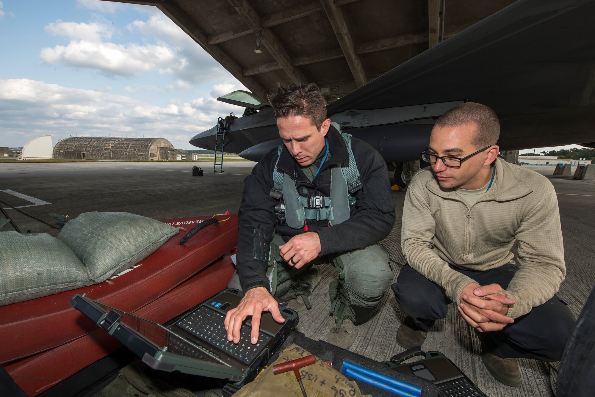 U.S. Air Force Lt. Col. Brandon Tellez, 525th Fighter Squadron commander and F-22 Raptor pilot, conducts pre-flight checks with Senior Airman Liam Vining, 525th Aircraft Maintenance Unit crew chief, Feb. 17, 2016, at Kadena Air Base, Japan. Four Raptors from the 525th FS stationed at Joint Base Elmendorf-Richardson conducted a combined formation flight alongside Republic of Korea and U.S. Air Force fighter aircraft in the vicinity of Osan Air Base, South Korea, to demonstrate the capabilities of the ROK-U.S. Alliance Feb. 17. The combined mission demonstrates the strength of the alliance between the United States and the Republic of Korea, and the resolve of both nations to maintain stability and security on the peninsula. (U.S. Air Force photo by Staff Sgt. Maeson L. Elleman)