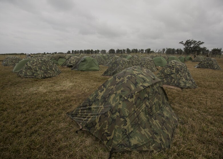 Rows of tents stand ready for use inside a forward operations base Feb. 3 on Ie Shima, Okinawa, Japan. Marines with 9th Engineer Support Battalion, 3rd Marine Logistics Group, III Marine Expeditionary Force performed a field training exercise Jan. 25 to Feb. 4. The purpose of the exercise was to test the unit’s ability to deploy and usecommand and control ability over a wide area. While on Ie Shima, the 9th ESB Marines were subject to erratic rain, grimy mud, bone chilling winds and cold.