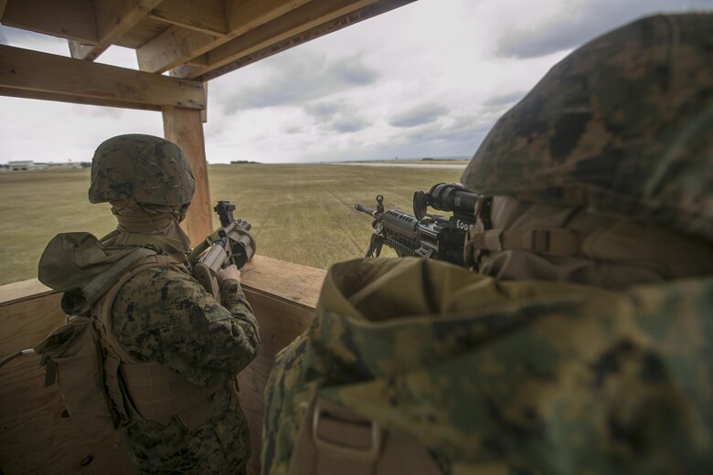 Marines post security during a field training exercise Feb. 3 on Ie Shima, Okinawa, Japan. Marines with 9th Engineer Support Battalion, 3rd Marine Logistics Group, III Marine Expeditionary Force performed a field training exercise Jan. 25 to Feb. 4. The purpose of the exercise was to test the unit’s ability to deploy and command and control ability over a wide area.