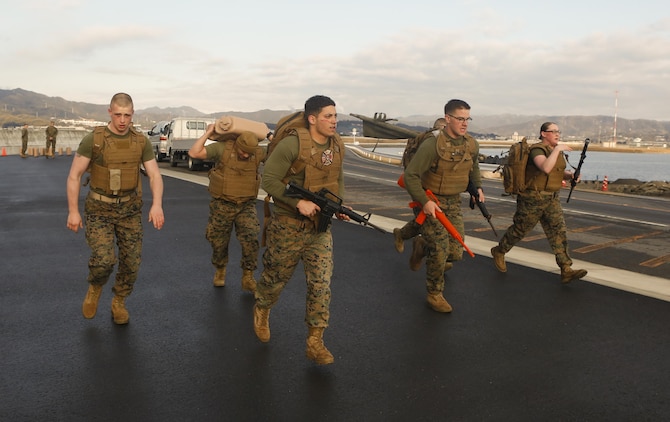 Marines with Headquarters and Headquarters Squadron participate in a 5k supply run during the Frozen Chosin Competition at Marine Corps Air Station Iwakuni, Japan, Feb. 25, 2016. Teams consisting of six members completed a series of events including a pull up and sit up contest, a 5k supply run, a 600 meter swim, 250 meter sprint then constructing and presenting professional military education. According to Lance Cpl. Klayton Inmon, personnel administration clerk at the Installation Personnel Administration Center outbound management branch, competition builds Marines physically and mentally by pushing them past their limits and allowing them to accomplish the mission.