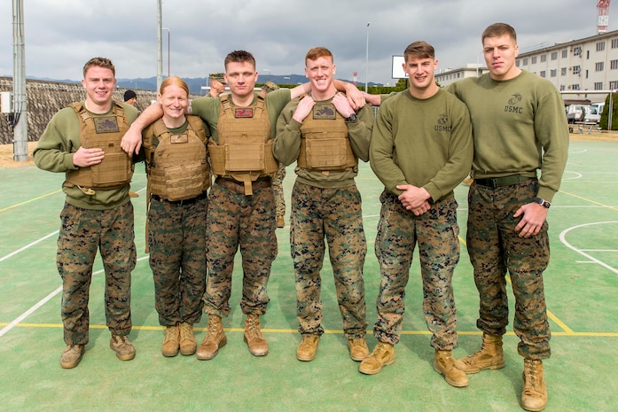 Marines with the provost marshal’s office K-9 unit pose for a picture after winning the Frozen Chosin Competition at Marine Corps Air Station Iwakuni, Japan, Feb. 25, 2016. Teams consisting of six members completed a series of events including a pull up and sit up contest, a 5k supply run, a 600 meter swim, 250 meter sprint then constructing and presenting professional military education. The winner of the event will either take a trip to Iwo Jima or the demilitarized zone, a strip of land running across the Korean Peninsula that serves as a buffer zone between North and South Korea. Crossing the 38th parallel, the DMZ cuts Korea in half and is the most heavily armed border in the world.