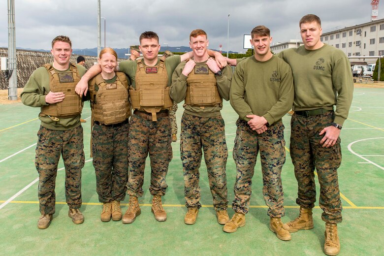 Marines with the provost marshal’s office K-9 unit pose for a picture after winning the Frozen Chosin Competition at Marine Corps Air Station Iwakuni, Japan, Feb. 25, 2016. Teams consisting of six members completed a series of events including a pull up and sit up contest, a 5k supply run, a 600 meter swim, 250 meter sprint then constructing and presenting professional military education. The winner of the event will either take a trip to Iwo Jima or the demilitarized zone, a strip of land running across the Korean Peninsula that serves as a buffer zone between North and South Korea. Crossing the 38th parallel, the DMZ cuts Korea in half and is the most heavily armed border in the world.