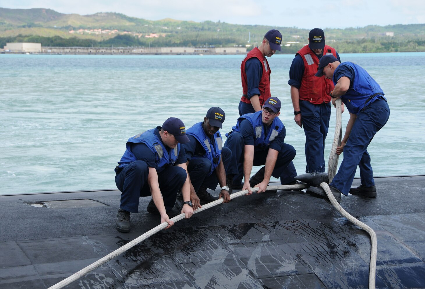 130425-N-LS794-133 APRA HARBOR, Guam (April 25, 2013) – Sailors aboard the Los Angeles-class fast attack submarine USS Chicago (SSN 721) secure mooring lines in Apra Harbor as Chicago returns from their first mission attached to Commander, Submarine Squadron FIFTEEN.  Chicago was out to sea for seven weeks conducting operations in the 7th Fleet area of responsibility.  (U.S. Navy photo by Mass Communication Specialist 1st Class Jeffrey Jay Price/Released)