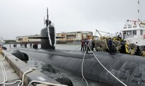 130809-N-LS794-048 APRA HARBOR, Guam (Sept. 20, 2013) – Sailors aboard the Los Angeles-class fast attack submarine USS Chicago (SSN 721) secures mooring lines as Chicago returns from an 11-week deployment in the 7th Fleet Area of Responsibility.  Chicago is one of three forward deployed submarines stationed in Guam.  (U.S. Navy photo by Mass Communication Specialist 1st Class Jeffrey Jay Price/Released)