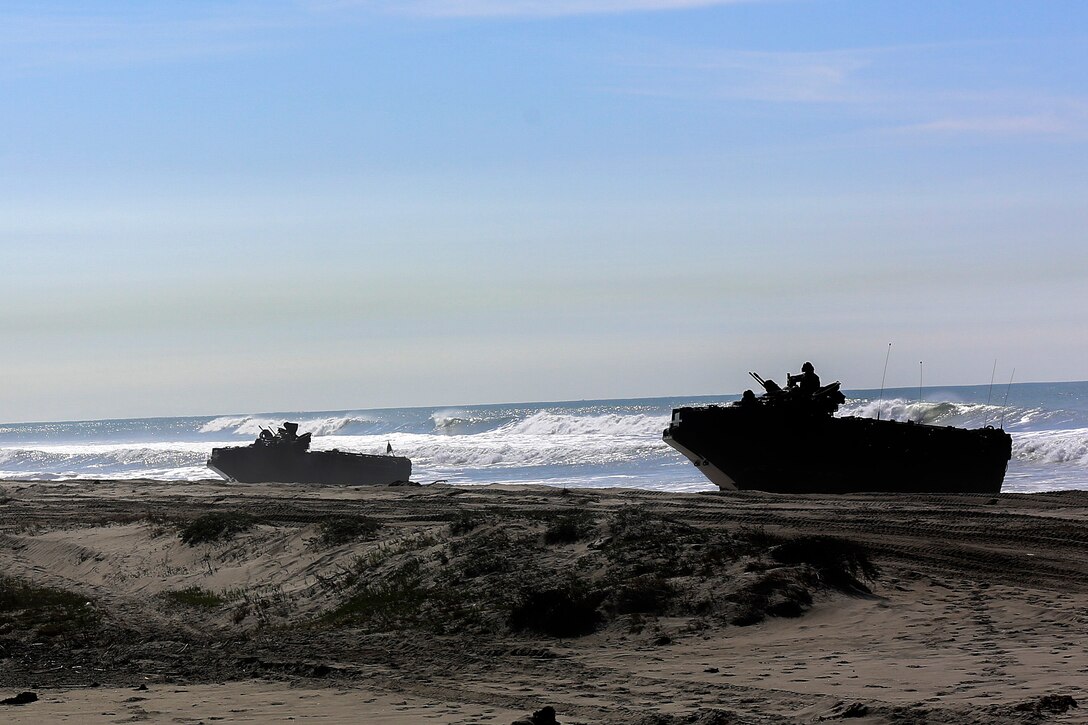 Marine amphibious assault vehicles come ashore during training that's part of Exercise Iron Fist 2016 off the shore of Marine Corps Base Camp Pendleton, Calif., Feb. 26, 2016. U.S. Marine Corps photo by Cpl. April L. Price