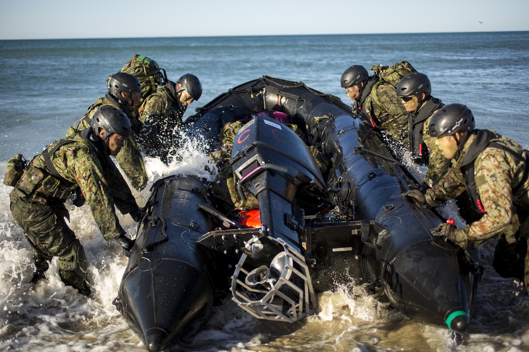 Japanese soldiers push an F470 raiding craft into position during a beach landing exercise as part of training for Exercise Iron Fist 2016 at Marine Corps Base Camp Pendleton, Calif., Feb. 24, 2016. U.S. Marine Corps photo by Lance Cpl. Ryan Kierkegaard 