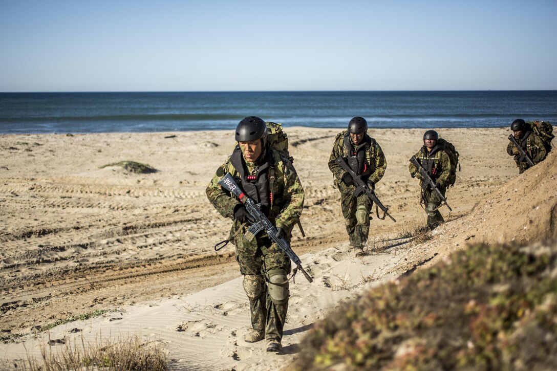 Japanese soldiers move to secured positions during a beach landing exercise that's part of training for Exercise Iron Fist 2016 at Marine Corps Base Camp Pendleton, Calif., Feb. 24, 2016. U.S. Marine Corps photo by Lance Cpl. Ryan Kierkegaard