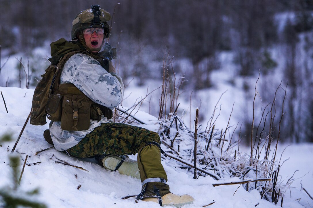 Marine Corps Cpl. Benjamin Peagler bellows a command to his team during a platoon assault drill as a part of Exercise Cold Response 16 on range U-3 in Frigard, Norway, Feb. 23, 2016. Peagler is assigned to India Company, 3rd Battalion, 2nd Marine Regiment, 2nd Marine Division. U.S. Marine Corps photo by Cpl. Rebecca Floto 