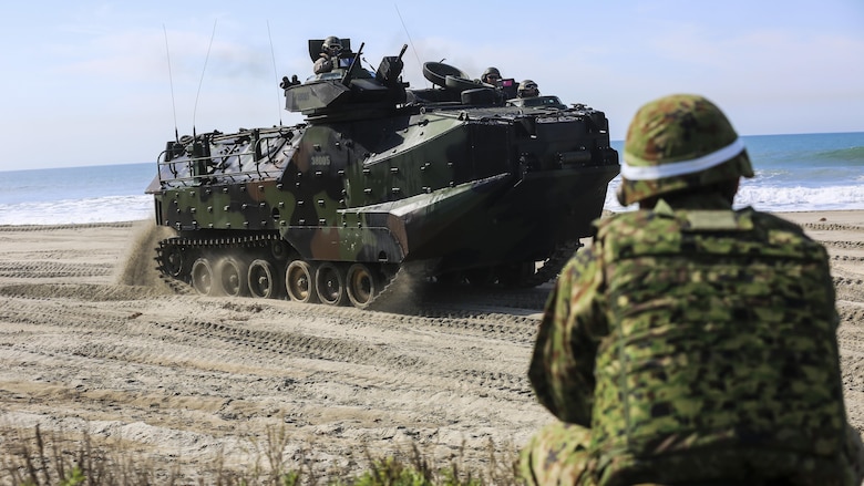 A Japan Ground Self-Defense Force solider provides security as an amphibious assault vehicle moves to a viable position to provide perimeter security during a scenario based, battalion-sized amphibious landing exercise for Exercise Iron Fist 2016, Feb. 26, 2016. Capable maritime forces help ensure stability and prosperity around the world, and bilateral exercises, like Iron Fist, help partner nations improve their own maritime capability.