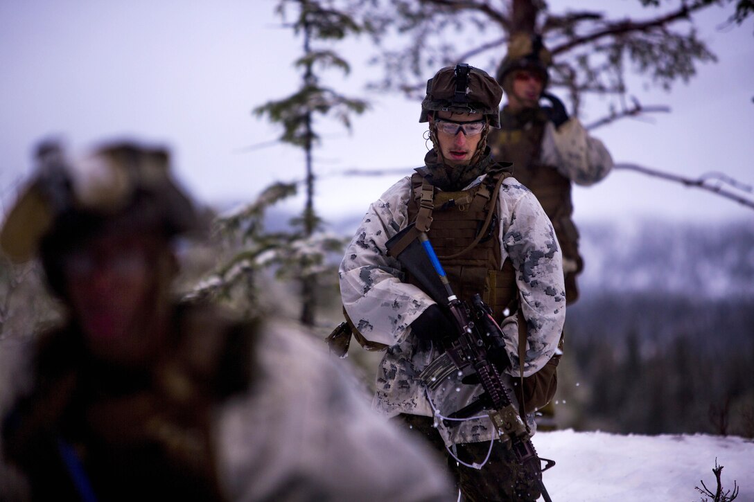 Marines patrol down a hill while participating in a platoon assault drill as a part of Exercise Cold Response 16 on range U-3 in Frigard, Norway, Feb. 23, 2016. U.S. Marine Corps photo by Cpl. Rebecca Floto