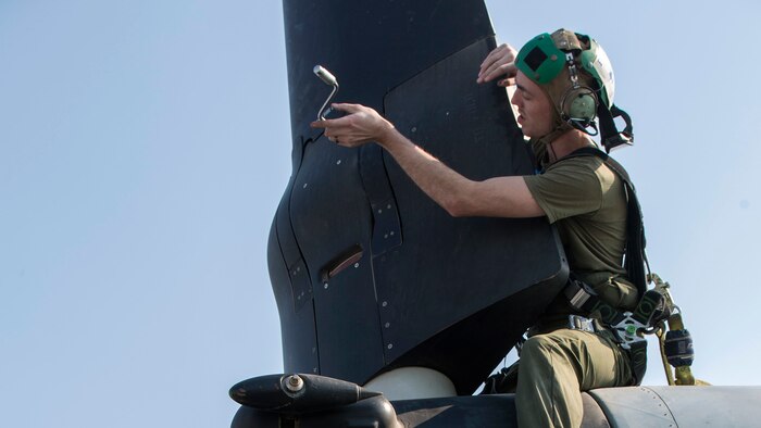 U.S. Marines Lance Cpl. Jeffrey J. Patrick (left) and Sgt. Matthew Moody, MV-22 mechanics with Marine Medium Tiltrotor Squadron 162 (Reinforced), 26th Marine Expeditionary Unit, conduct routine maintenance on the blades of an MV-22B Osprey aboard the USS Kearsarge (LHD 3), Feb. 17, 2016. The 26th MEU is embarked on the Kearsarge Amphibious Ready Group and is deployed to maintain regional security in the U.S. 5th Fleet area of operations.