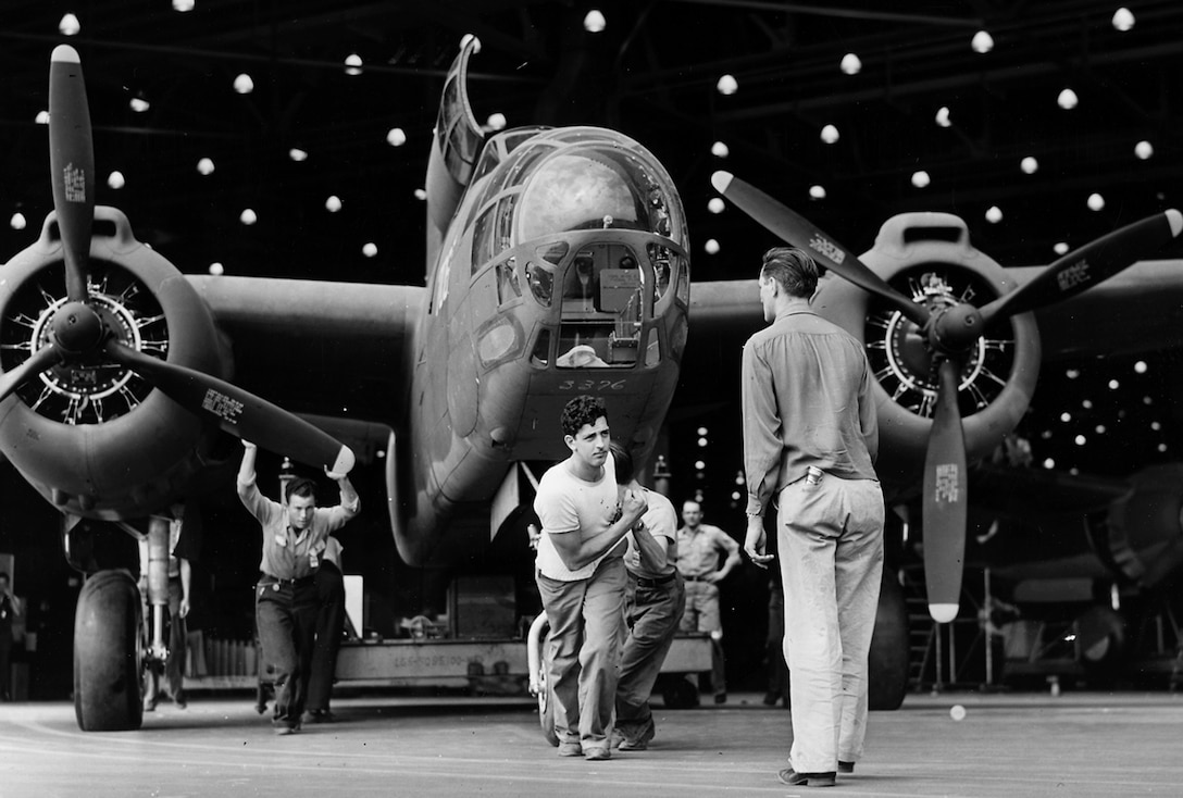 A Douglas A-20 attack bomber leaves the assembly line at the Long Beach, Calif., plant for transfer to the flight line and a test flight before delivery to the Army.