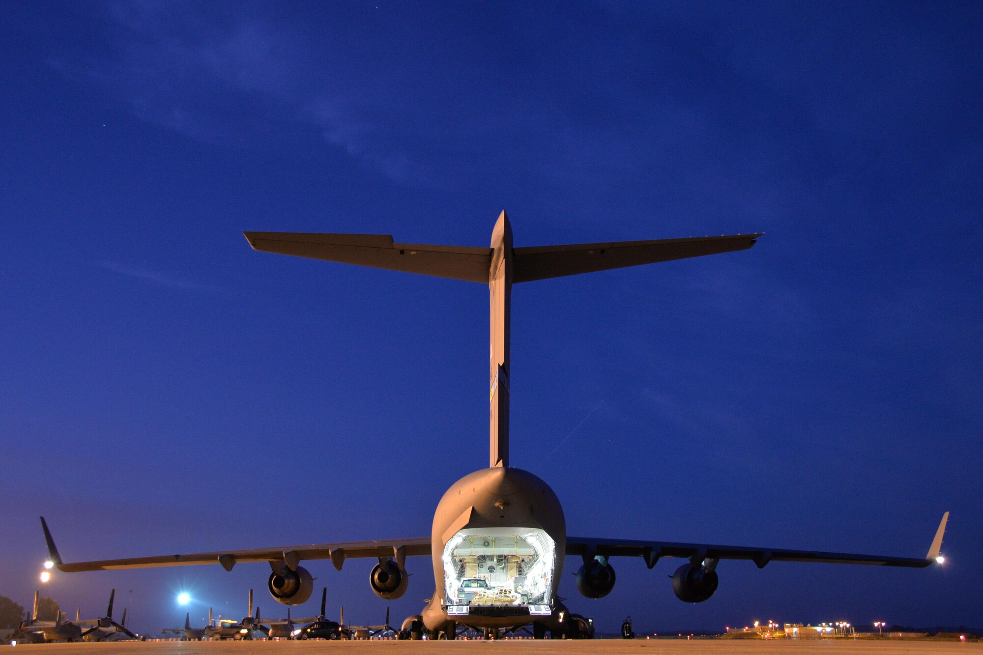 A C-17 Globemaster III lowers its cargo ramp while waiting to be unloaded at Morón Air Base, Spain, Feb. 24, 2016. The cargo was flown to Spain in preparation for Exercise Cold Response 16, a biennial NATO exercise involving nearly 16,000 troops from a dozen allied and partner nations. (U.S. Air Force photo/Senior Airman Joseph Raatz) 