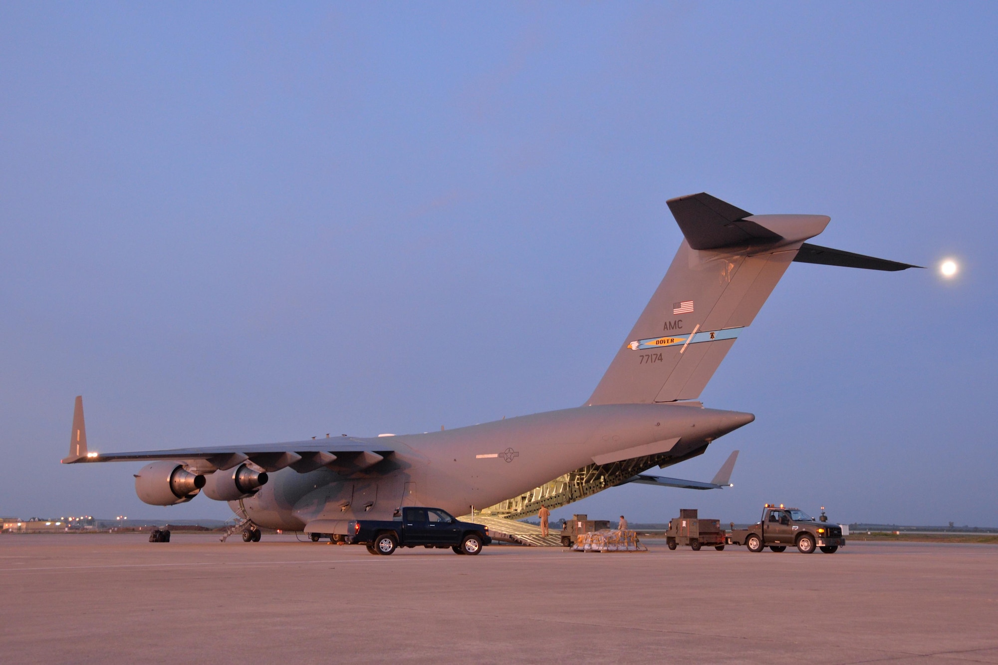 The moon hangs over Airmen unloading vehicles and equipment from a C-17 Globemaster III at Morón Air Base, Spain, Feb. 24, 2016. The cargo was delivered in support of Exercise Cold Response 16, a Norwegian-led NATO exercise designed to give allied militaries a chance to collectively develop tactics, techniques, and procedures and increase interoperability. (U.S. Air Force photo/Senior Airman Joseph Raatz) 